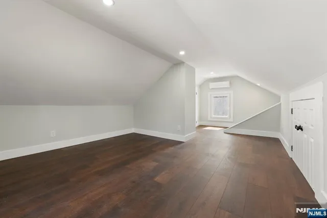 wooden floor in an empty room with a workspace