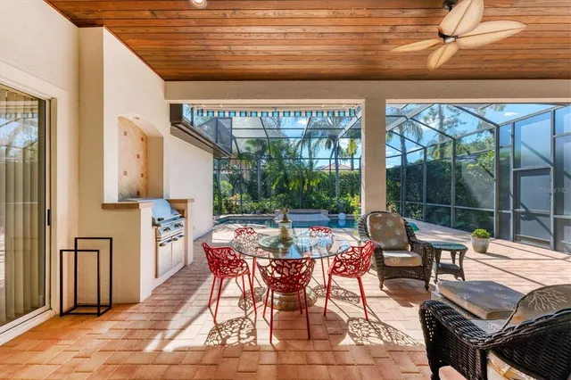 an aerial view of a golf course with a lake view