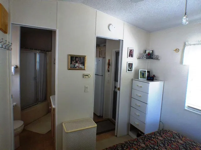 a bathroom with a shower toilet and sink