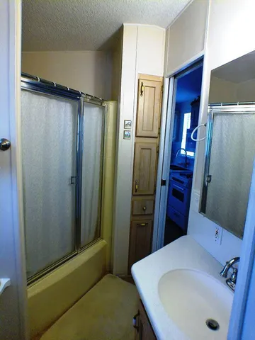 a bathroom with a tub and a sink