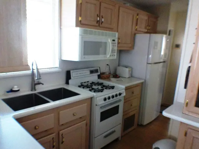a view of livingroom with furniture and windows