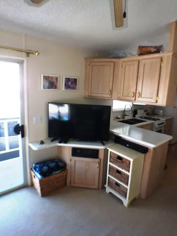 a kitchen with a cabinets and chairs
