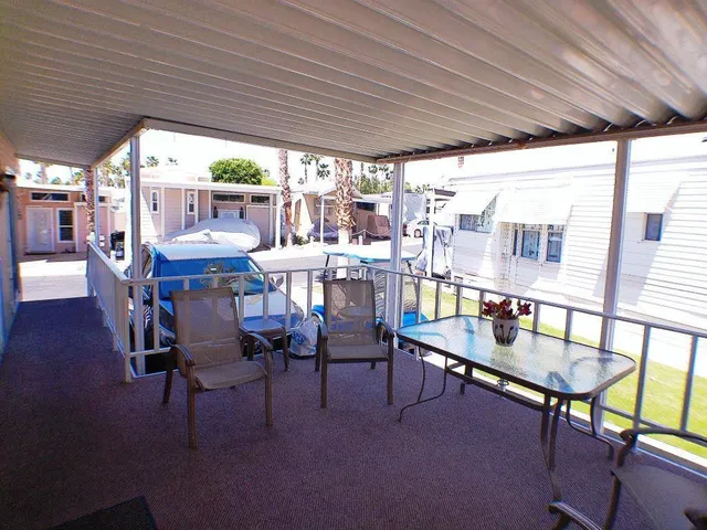 a outdoor dining space with furniture and outdoor view