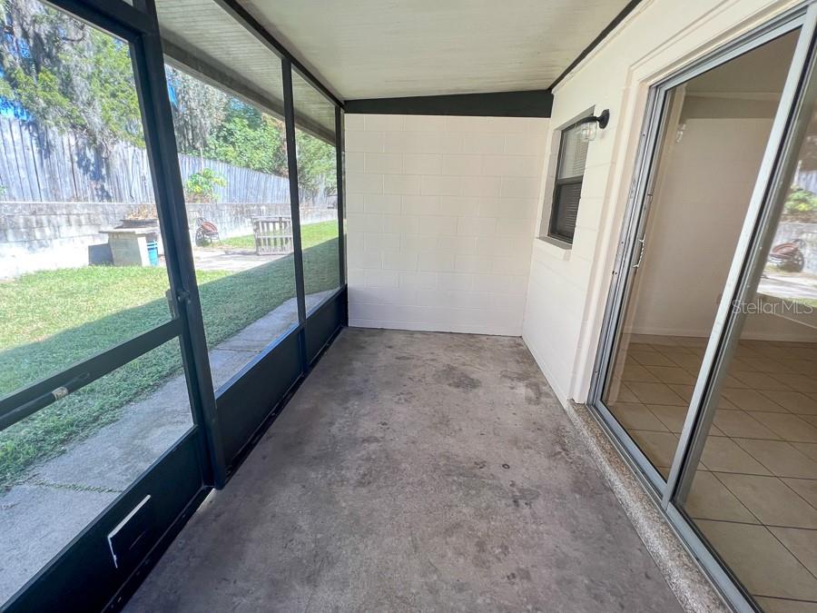 1406 Southwest 18th Place, Unit 4 Gainesville, FL 32608 - Photo 11 of 16 a view of a porch with wooden floor and a stairs
