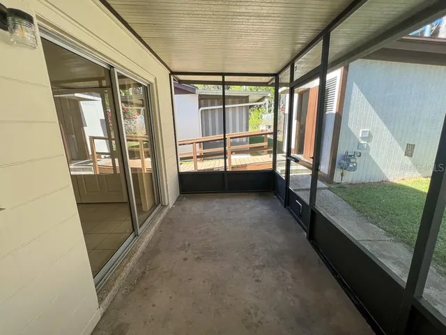 a view of balcony with wooden floor and iron stairs