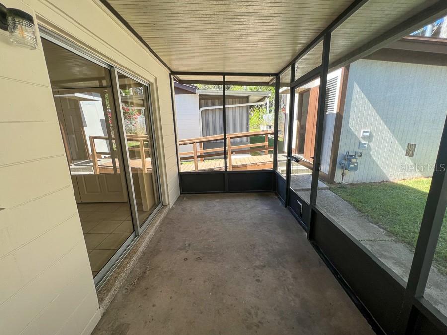 1406 Southwest 18th Place, Unit 4 Gainesville, FL 32608 - Photo 12 of 16 a view of an empty room with window