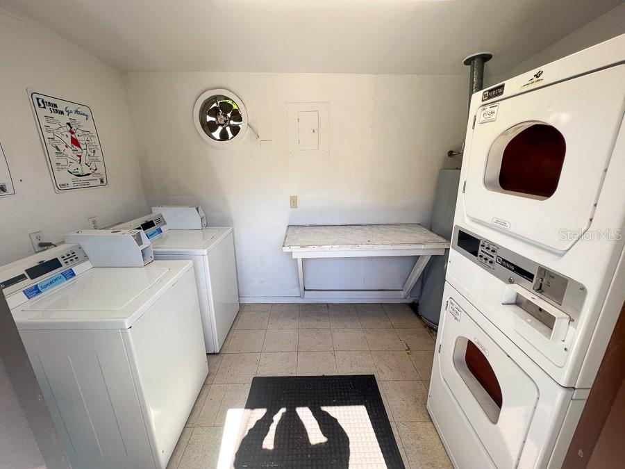 1406 Southwest 18th Place, Unit 4 Gainesville, FL 32608 - Photo 14 of 16 a utility room with dryer and washer