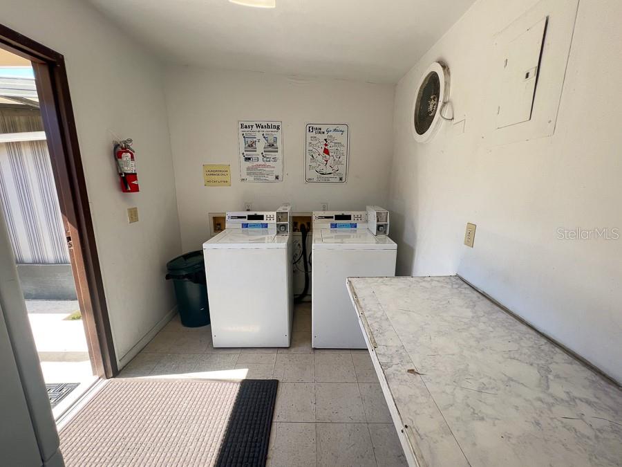1406 Southwest 18th Place, Unit 4 Gainesville, FL 32608 - Photo 16 of 16 a utility room with dryer and washer