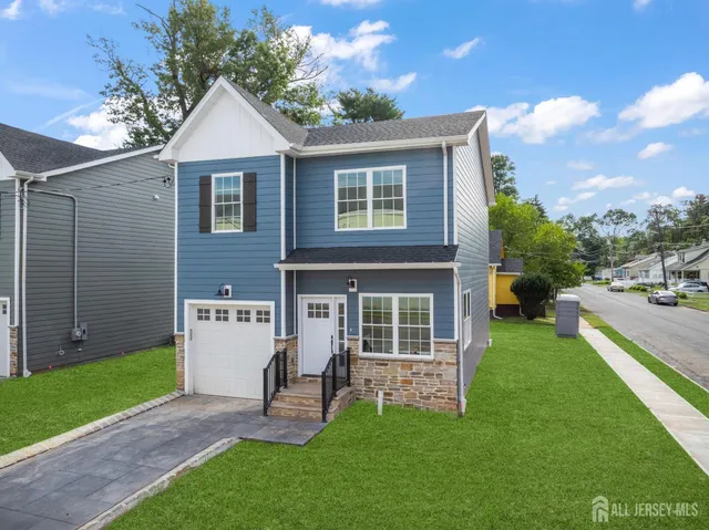 a view of a house with a yard porch and sitting area