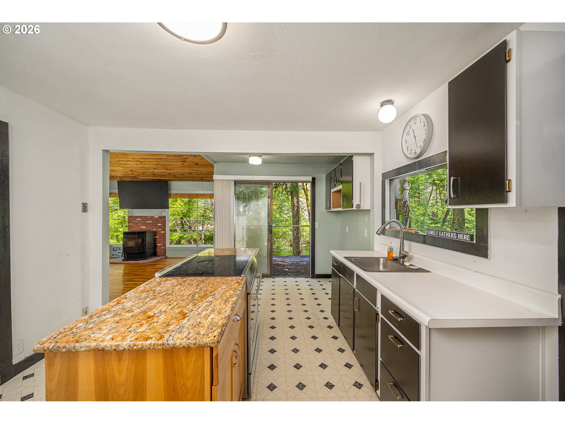 49091 Salt Creek Road Oakridge, OR 97463 - Photo 11 of 16 a kitchen with sink stove and cabinets