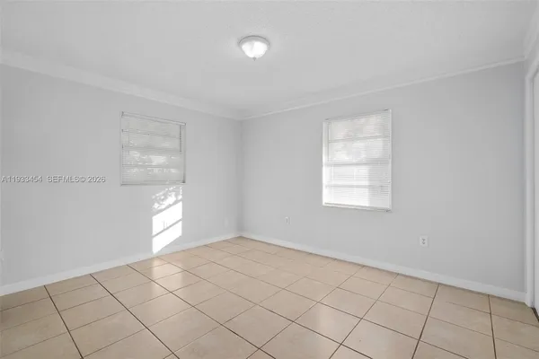 a view of an empty room and window