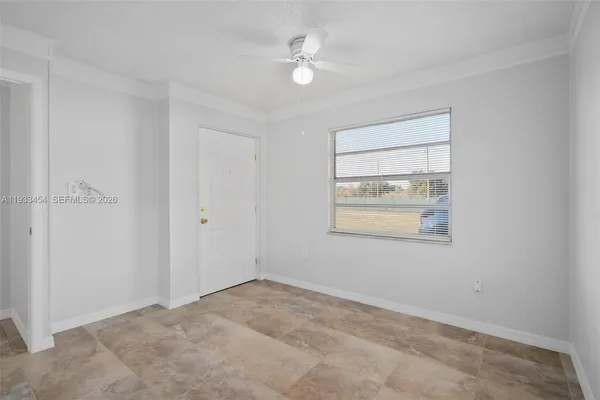 a view of an empty room with a window