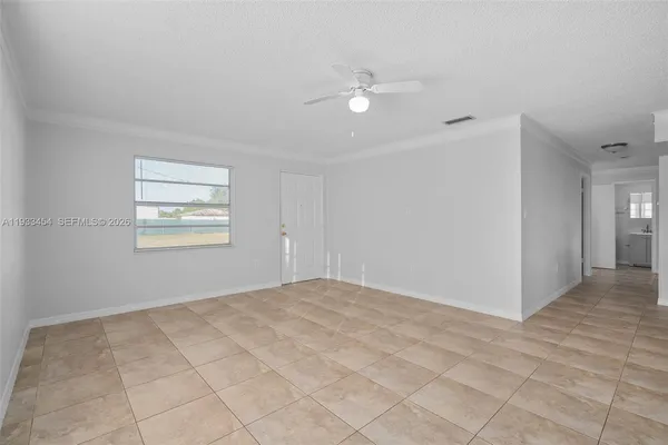 a view of an empty room with a window