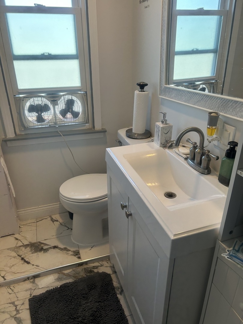 2816 West 85th Street Chicago, IL 60652 - Photo 13 of 22 a bathroom with a sink and a toilet