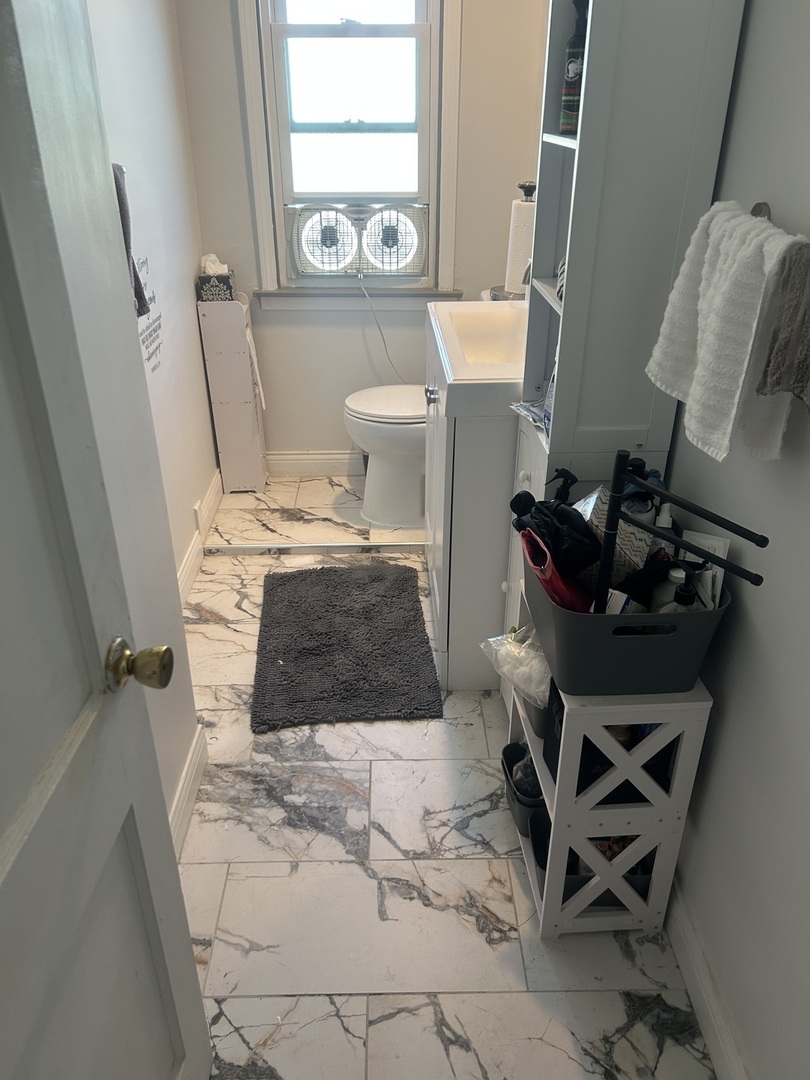 2816 West 85th Street Chicago, IL 60652 - Photo 14 of 22 a living room with a couch and a window