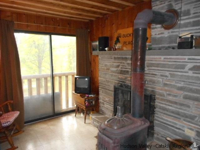 15 Belleayre Ridge Arkville, NY 12406 - Photo 16 of 27 a room with furniture and a fireplace