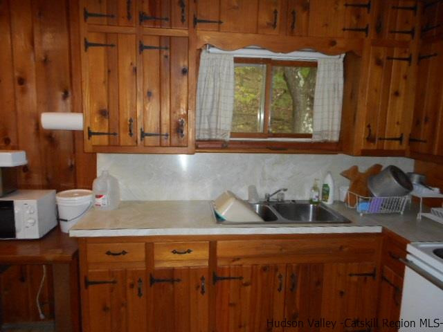 15 Belleayre Ridge Arkville, NY 12406 - Photo 22 of 27 a kitchen with a sink and cabinets