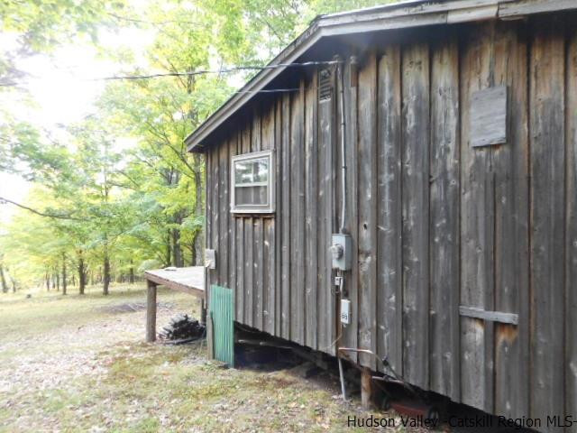 15 Belleayre Ridge Arkville, NY 12406 - Photo 8 of 27 a backyard of a house with outdoor seating and trees