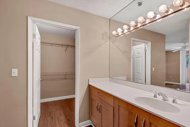 a bathroom with a double vanity sink and a mirror