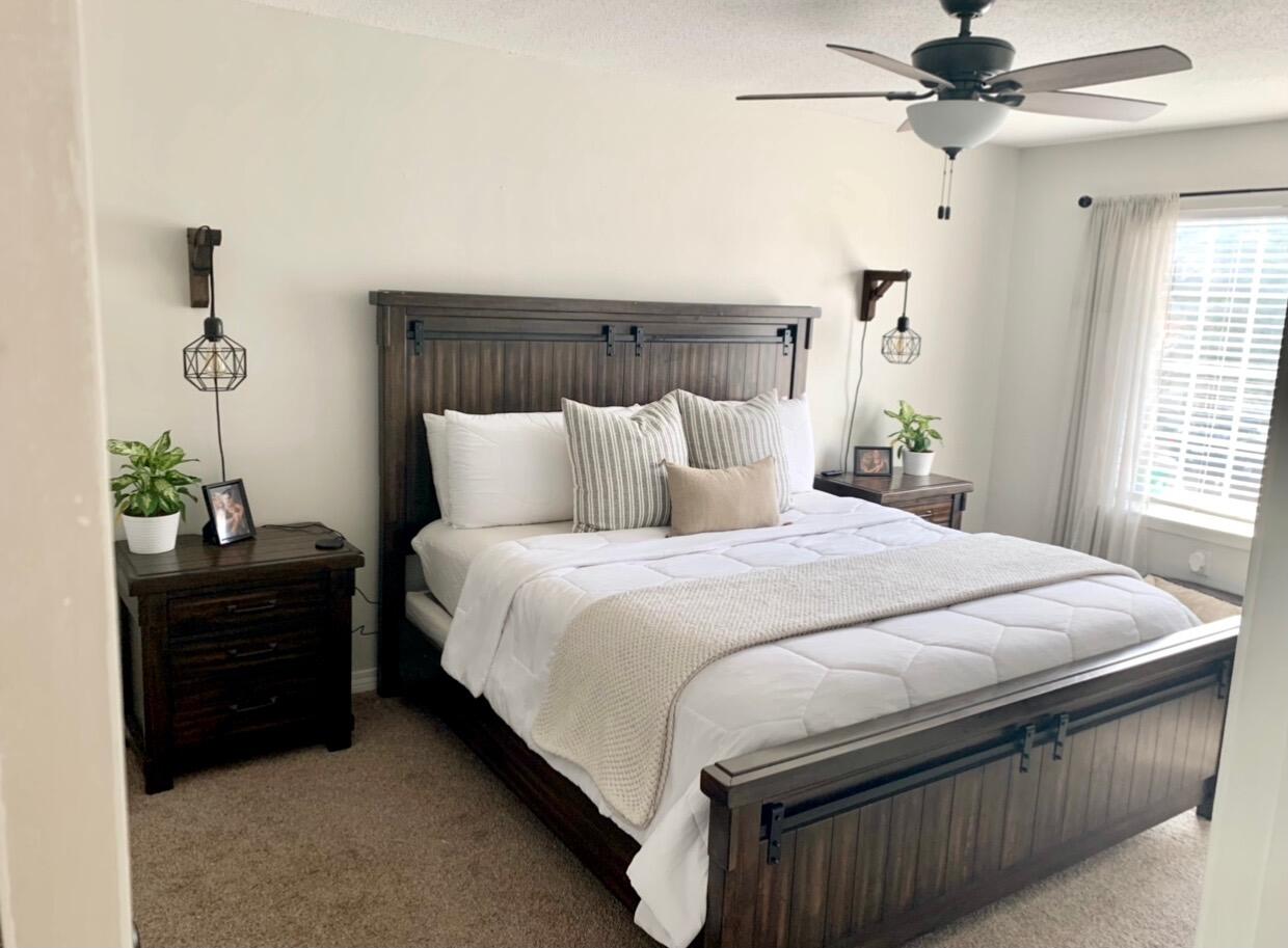 113 Scranton Street Fort Walton Beach, FL 32547 - Photo 6 of 7 a bedroom with a bed and a chandelier