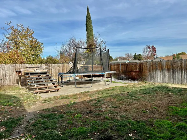 a view of a yard with a slide