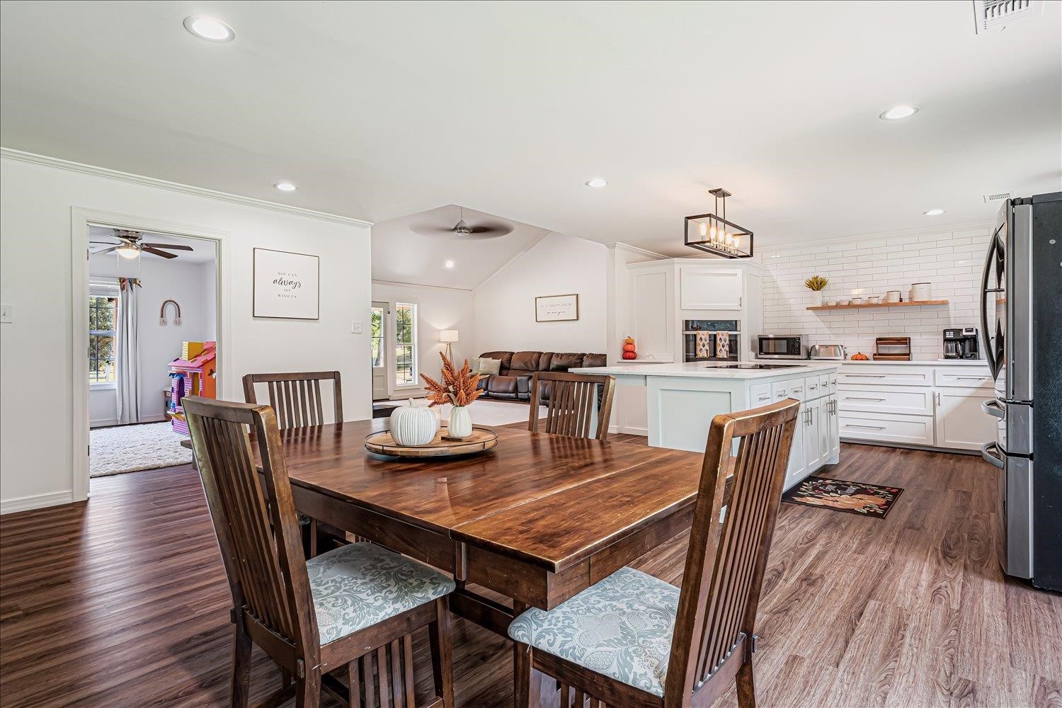 8159 Epperson Mill Road Millington, TN 38053 - Photo 12 of 31 a view of a dining room with furniture and wooden floor