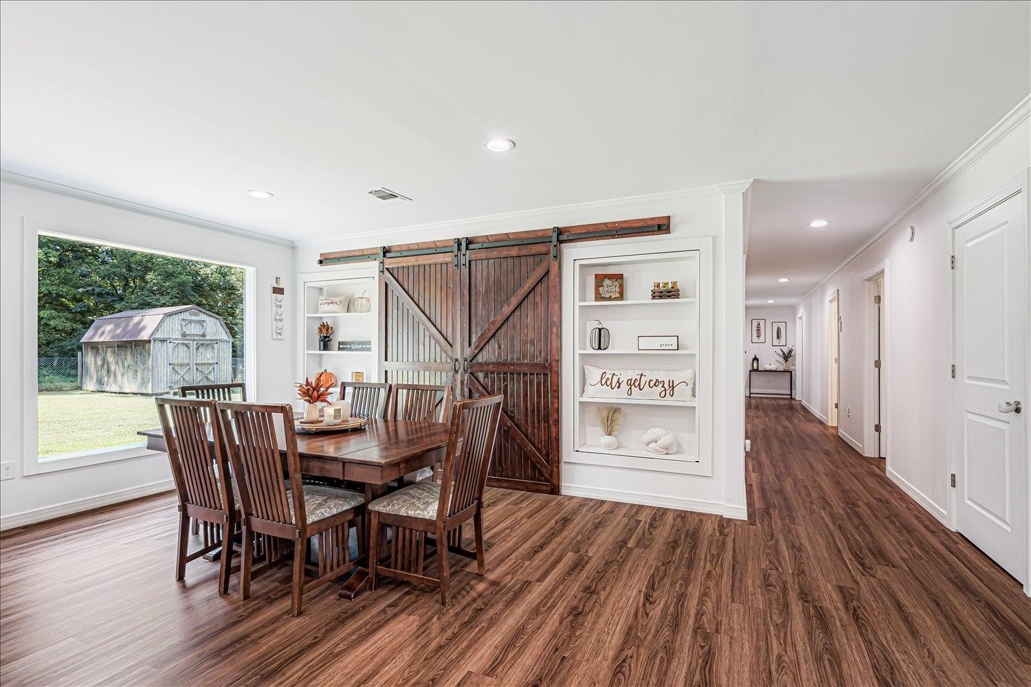 8159 Epperson Mill Road Millington, TN 38053 - Photo 13 of 31 a view of a dining room with furniture window and wooden floor