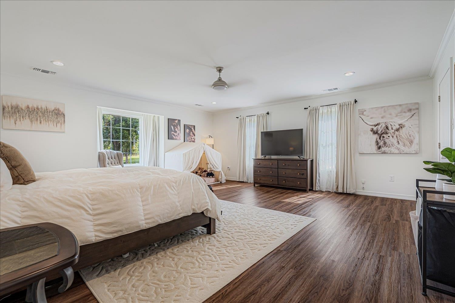 8159 Epperson Mill Road Millington, TN 38053 - Photo 14 of 31 a spacious bedroom with a bed and a flat screen tv