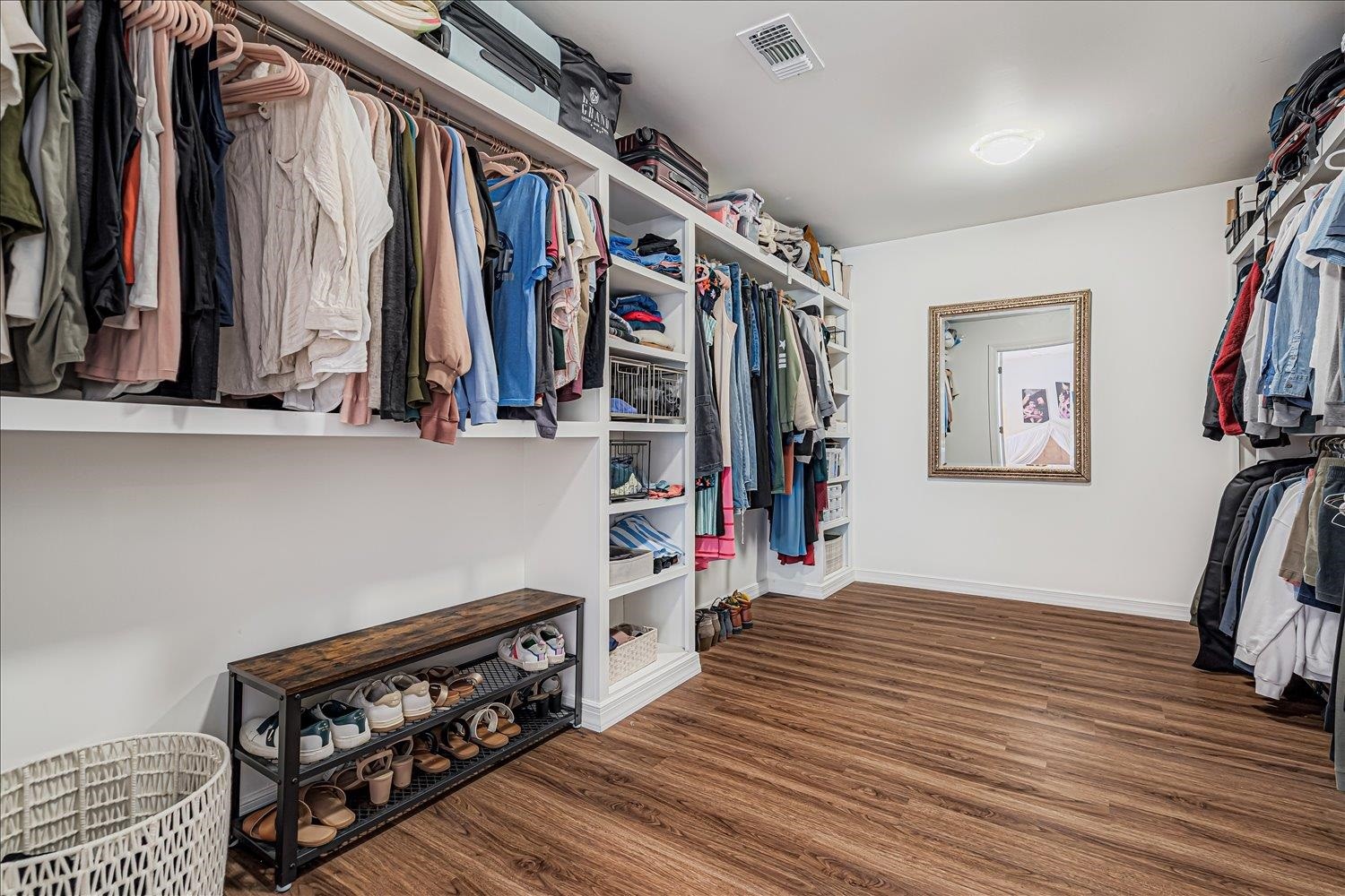 8159 Epperson Mill Road Millington, TN 38053 - Photo 17 of 31 a view of walk in closet with clothes and shoes