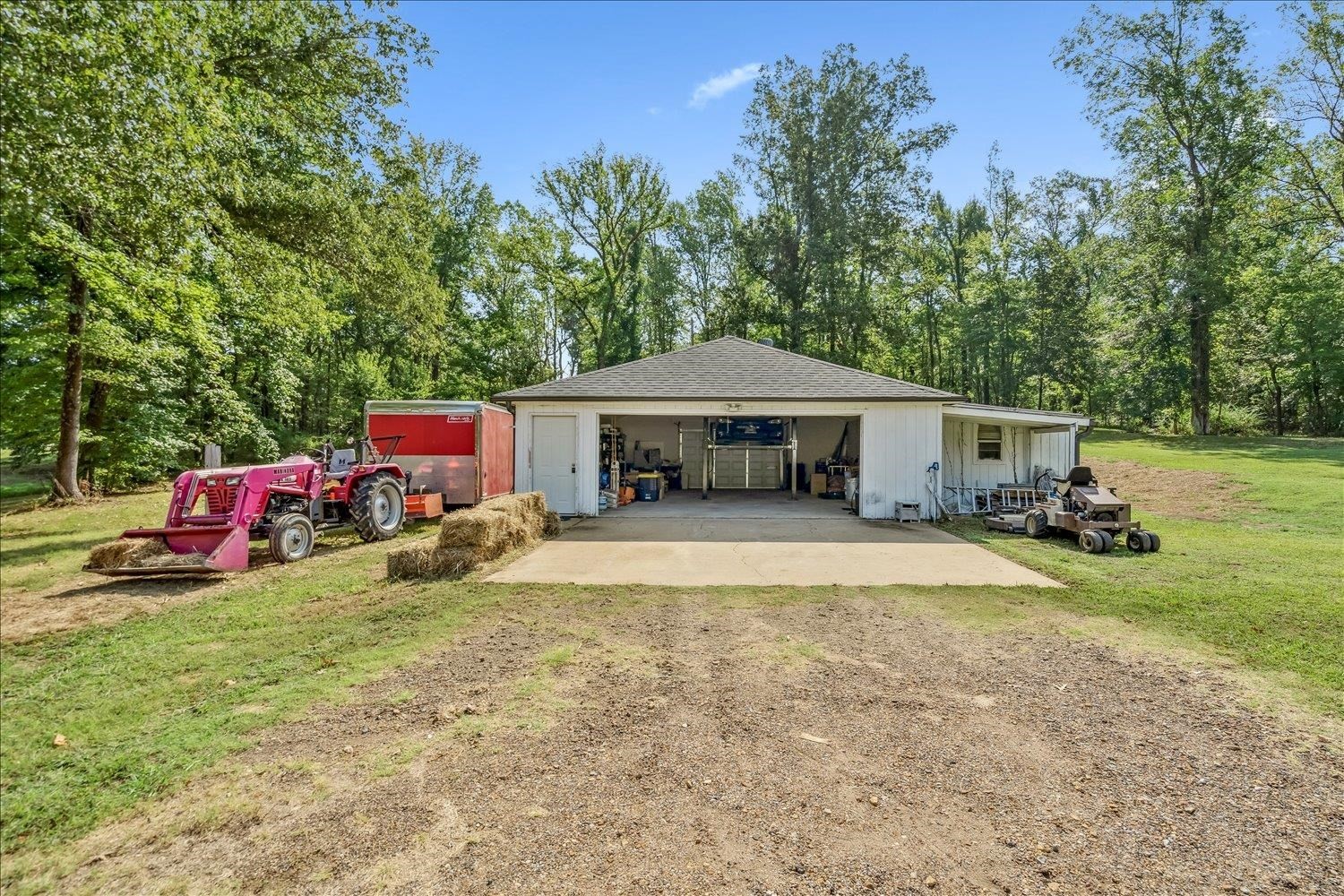 8159 Epperson Mill Road Millington, TN 38053 - Photo 31 of 31 a view of a house with backyard space and sitting area