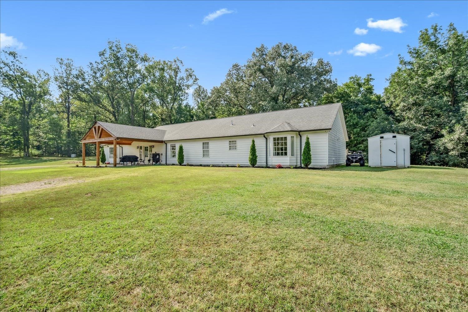 8159 Epperson Mill Road Millington, TN 38053 - Photo 5 of 31 a house with garden in front of it