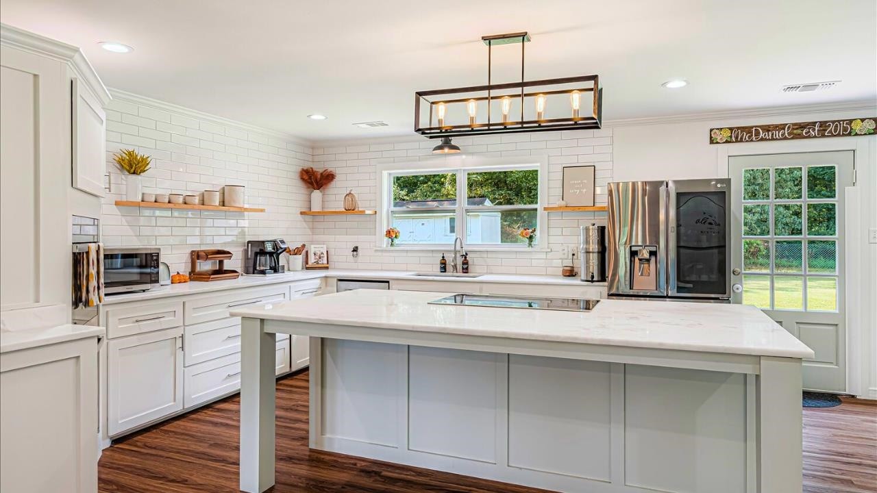 8159 Epperson Mill Road Millington, TN 38053 - Photo 7 of 31 a kitchen with stainless steel appliances a sink and a refrigerator