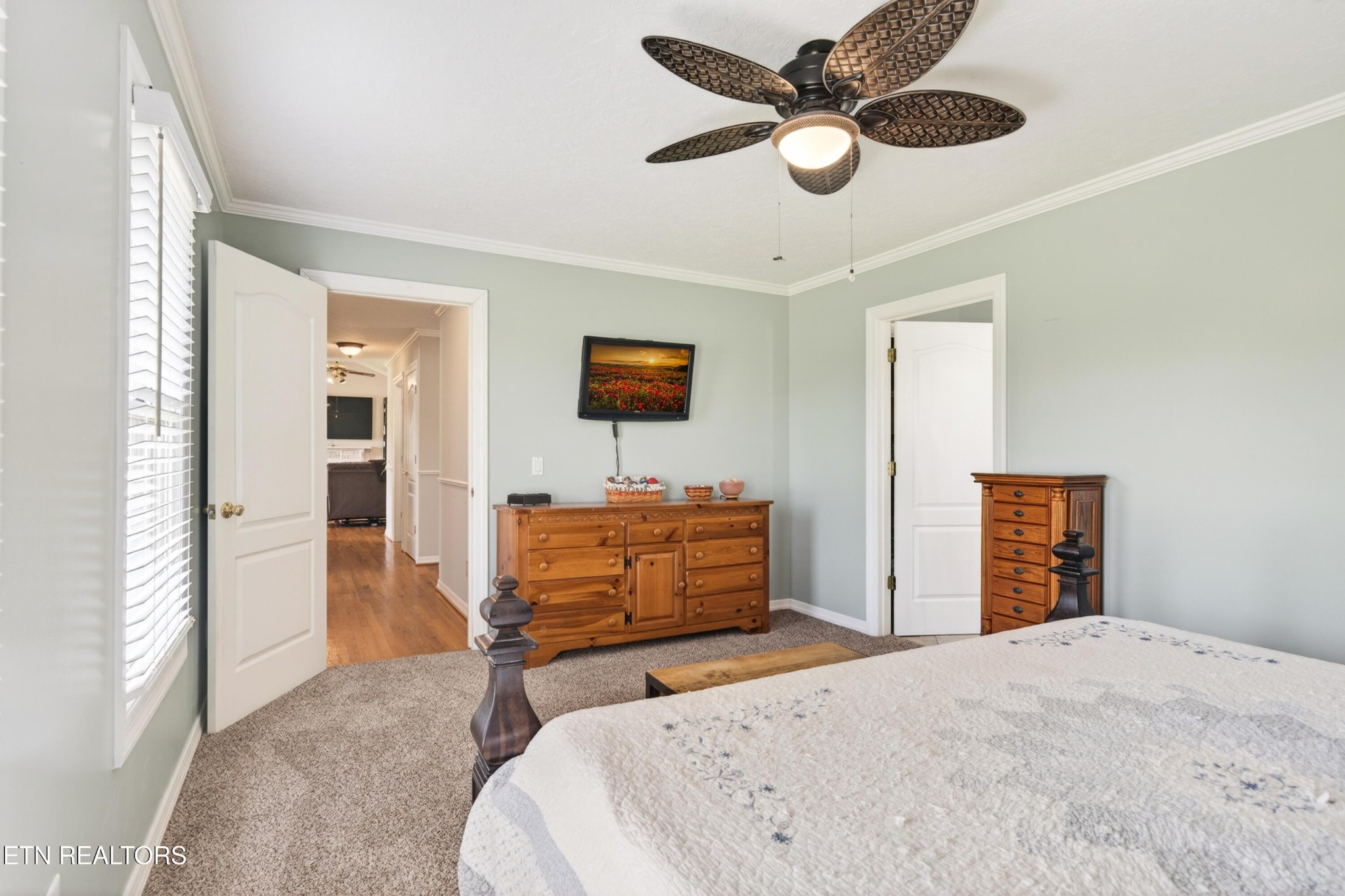 4015 Baxter Road Baxter, TN 38544 - Photo 19 of 48 a bedroom with a bed and a chandelier