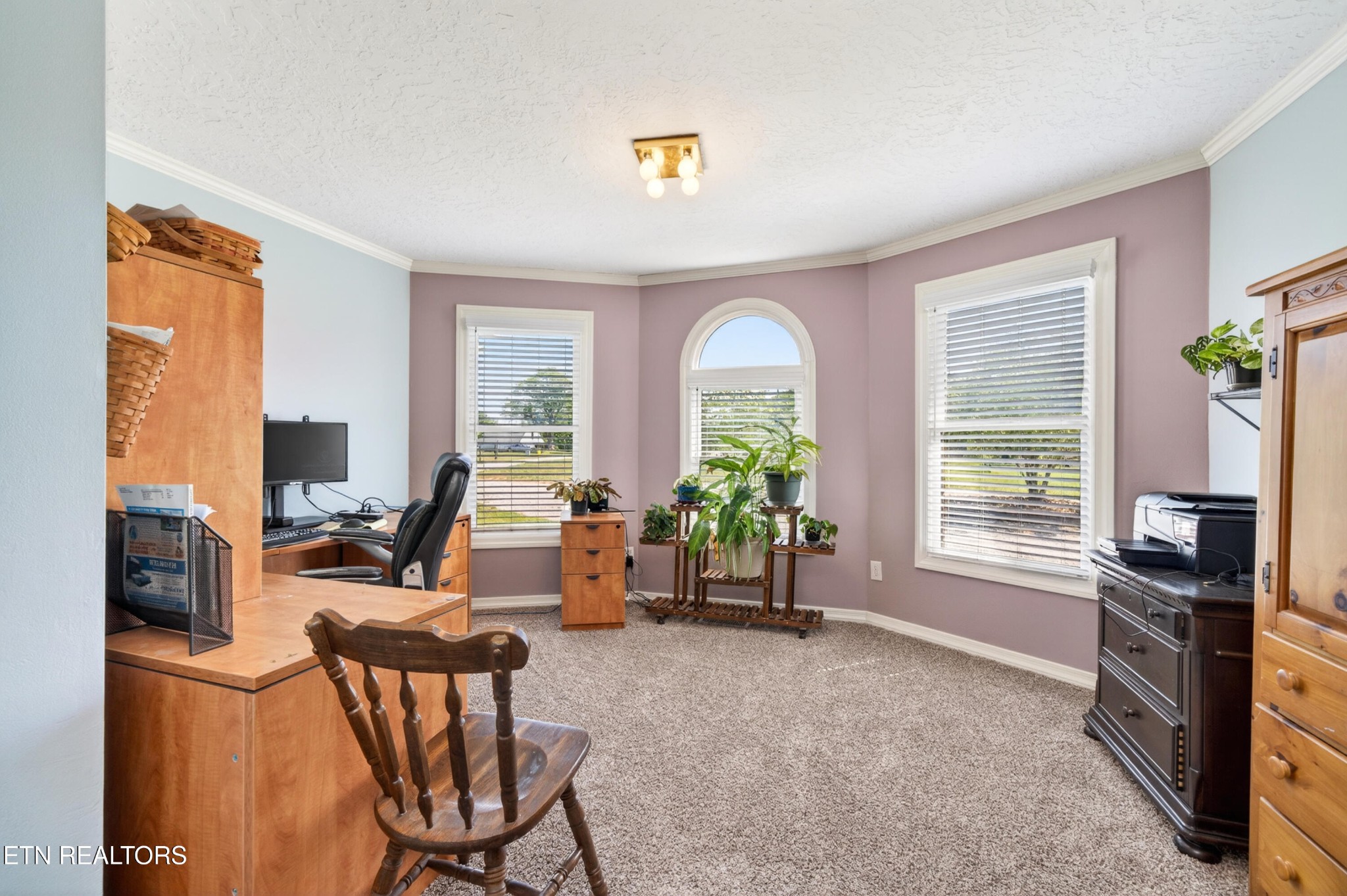 4015 Baxter Road Baxter, TN 38544 - Photo 23 of 48 a view of a livingroom with furniture a flat screen tv and windows