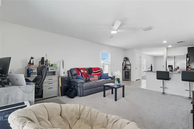 a living room with furniture and a view of living room