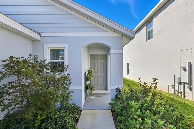 a front view of a house with trees