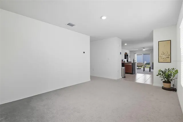 a view of a livingroom with furniture and an entryway