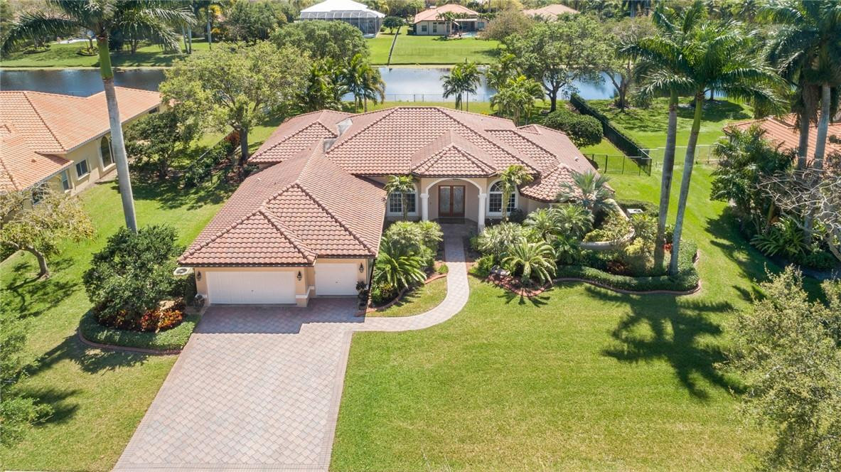 10324 Southwest 26th Street Davie, FL 33324 - Photo 1 of 37 a aerial view of a house with yard