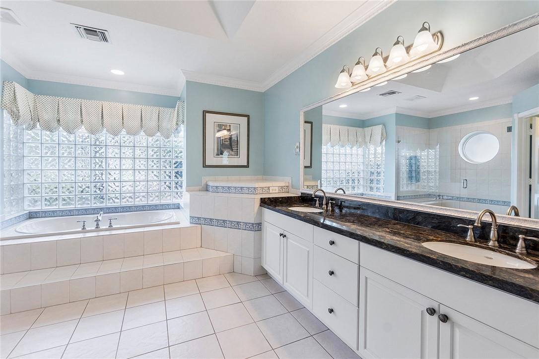 10324 Southwest 26th Street Davie, FL 33324 - Photo 17 of 37 a large bathroom with a large tub sink and double vanity