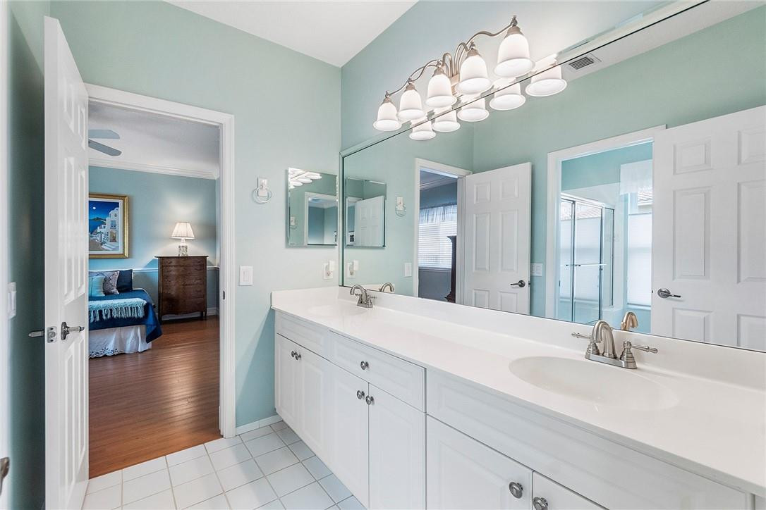 10324 Southwest 26th Street Davie, FL 33324 - Photo 20 of 37 a en suite bathroom with a double vanity sink and a mirror