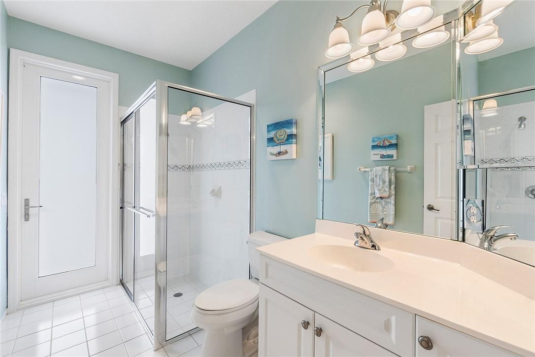 10324 Southwest 26th Street Davie, FL 33324 - Photo 24 of 37 a bathroom with a sink a toilet and a large mirror
