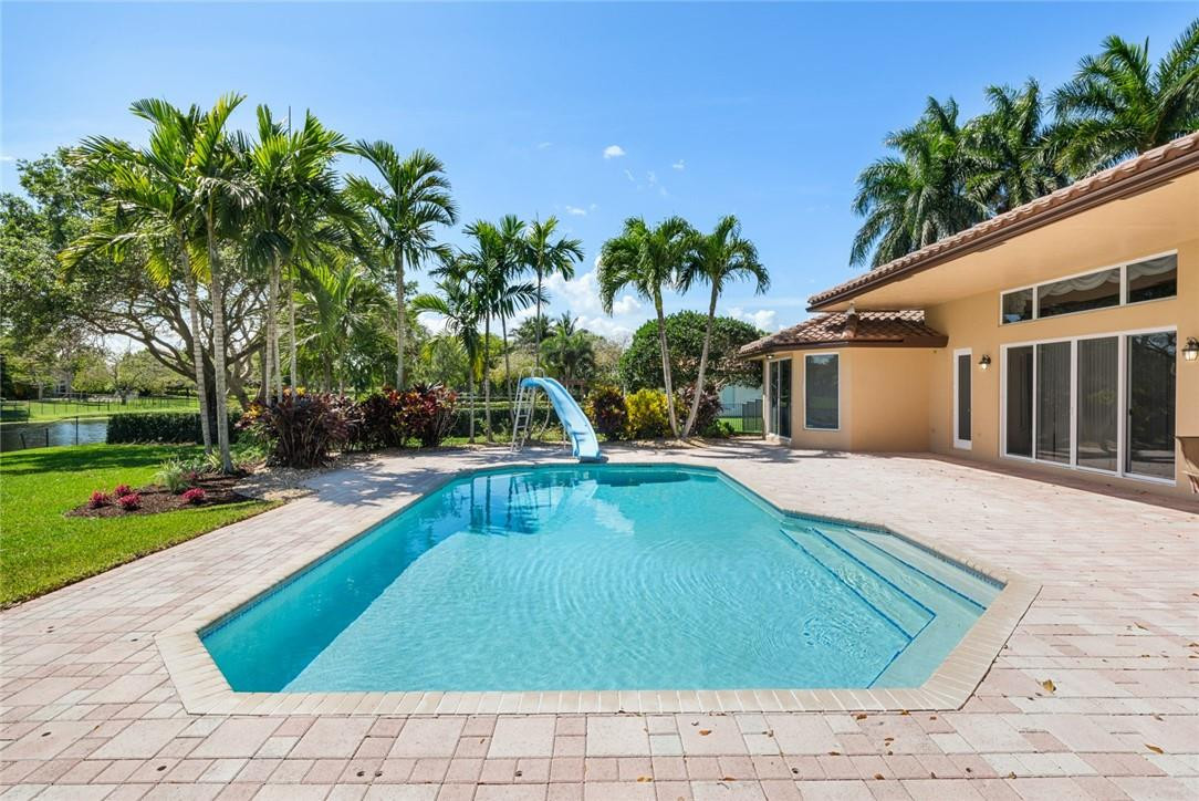 10324 Southwest 26th Street Davie, FL 33324 - Photo 29 of 37 a view of a house with swimming pool