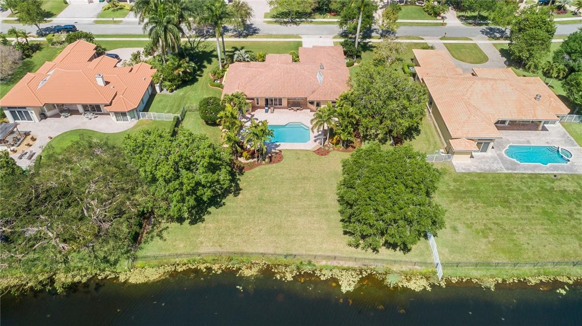 10324 Southwest 26th Street Davie, FL 33324 - Photo 3 of 37 an aerial view of house with yard swimming pool and outdoor seating
