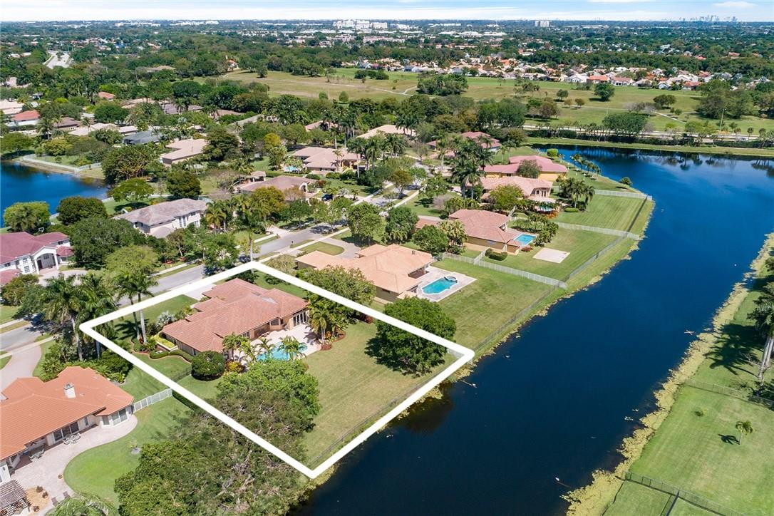 10324 Southwest 26th Street Davie, FL 33324 - Photo 35 of 37 an aerial view of residential houses with outdoor space