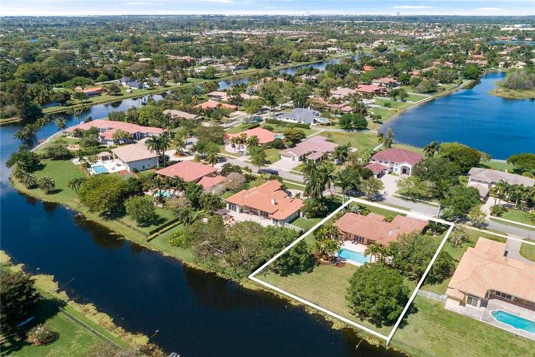 10324 Southwest 26th Street Davie, FL 33324 - Photo 36 of 37 an aerial view of residential houses with outdoor space