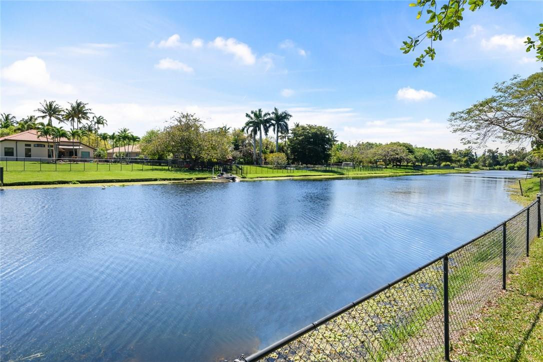 10324 Southwest 26th Street Davie, FL 33324 - Photo 37 of 37 a view of a lake with a wooden bridge