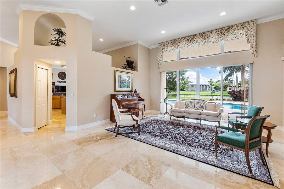 10324 Southwest 26th Street Davie, FL 33324 - Photo 7 of 37 a living room with furniture a large window with outer view
