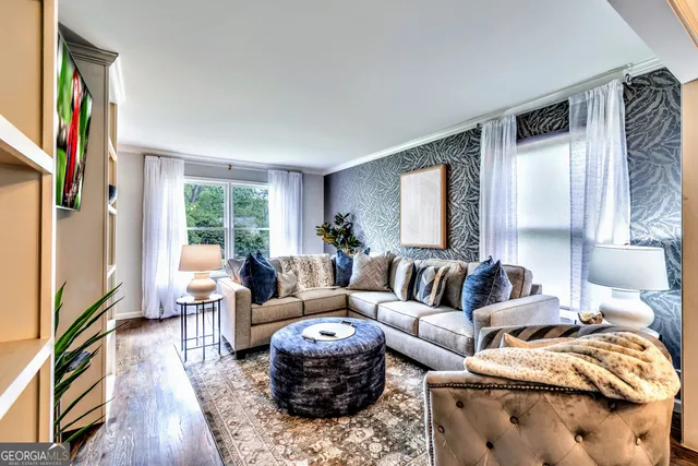 a living room with furniture and a window