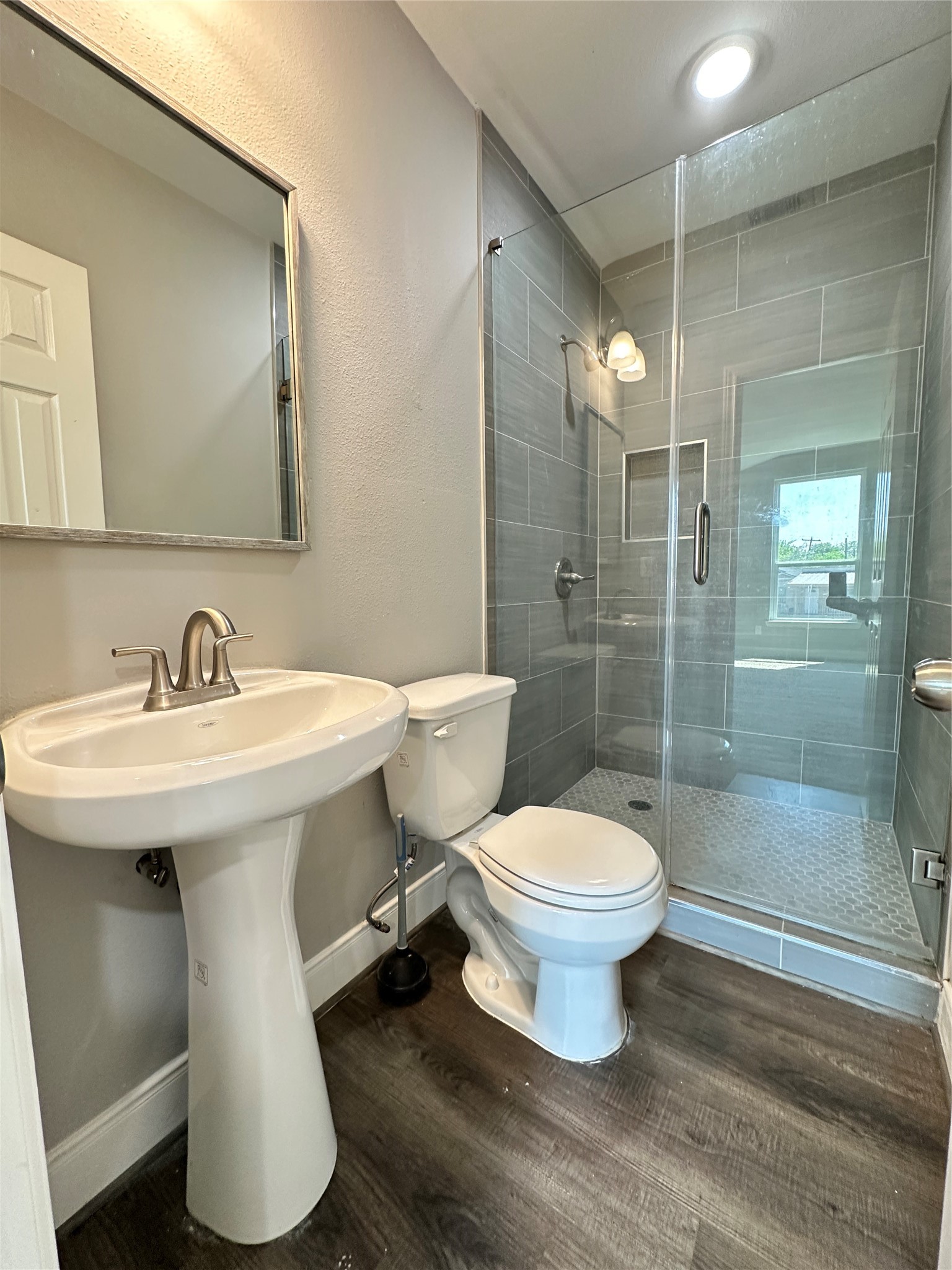 12703 West Hardy Road Houston, TX 77037 - Photo 27 of 29 a bathroom with a sink toilet and shower