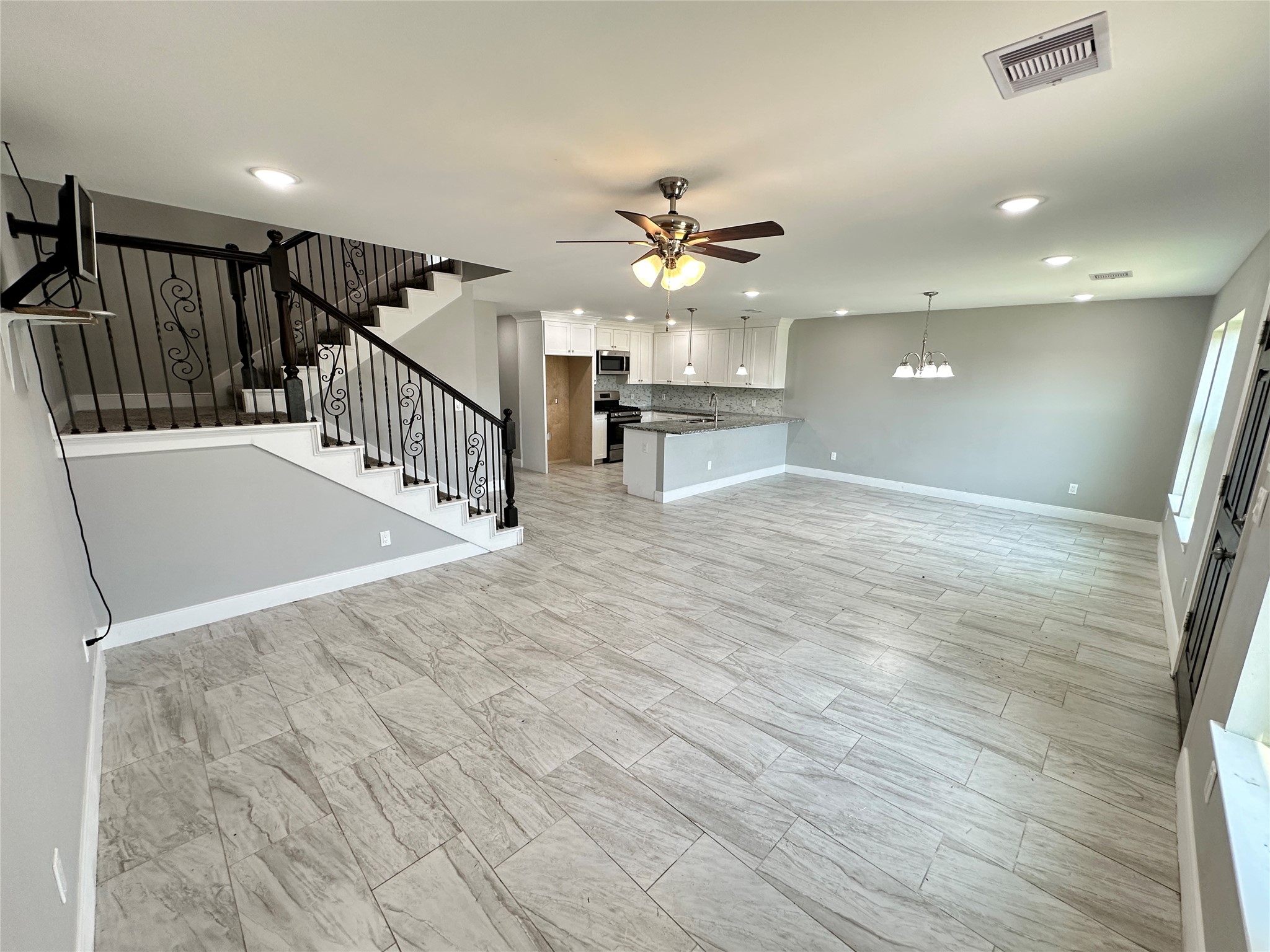 12703 West Hardy Road Houston, TX 77037 - Photo 6 of 29 a view of entryway and hall with wooden floor